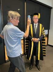 Mark Scott Vice Chancellor being photographed by Simon Fieldhouse